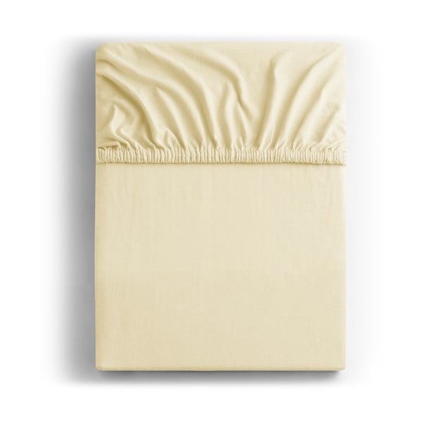 Kremowe bawełniane prześcieradło elastyczne DecoKing Amber Collection, 80/90x200 cm