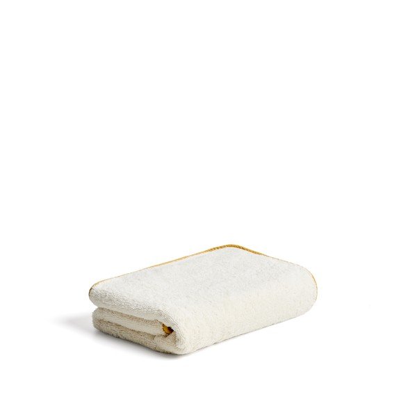 Żółty/biały bawełniany ręcznik kąpielowy frotte 70x140 cm Sedora – Kave Home