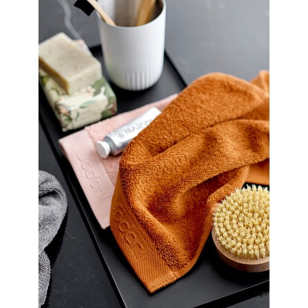 Pomarańczowy ręcznik z bawełny frotte Södahl Clay, 100x50 cm-image-1