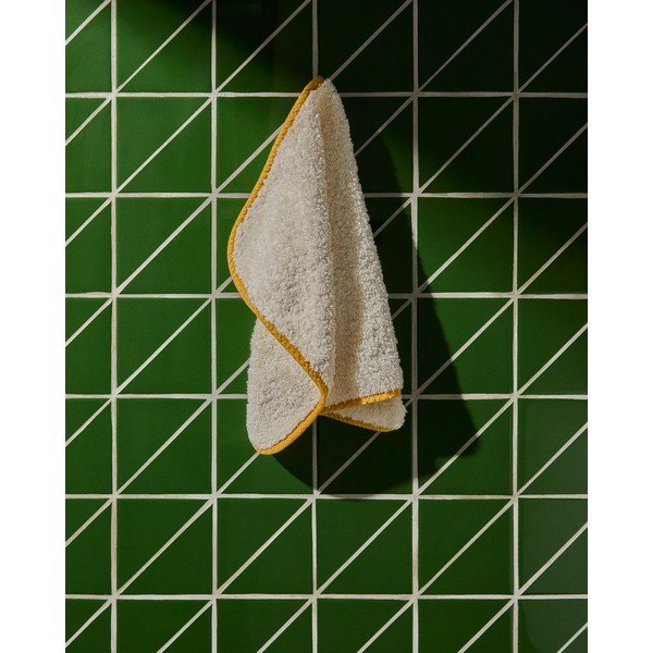 Żółty/biały bawełniany ręcznik frotte 30x50 cm Sedora – Kave Home-image-1