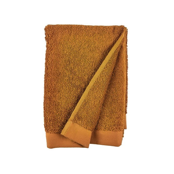 Pomarańczowy ręcznik z bawełny frotte Södahl Clay, 100x50 cm