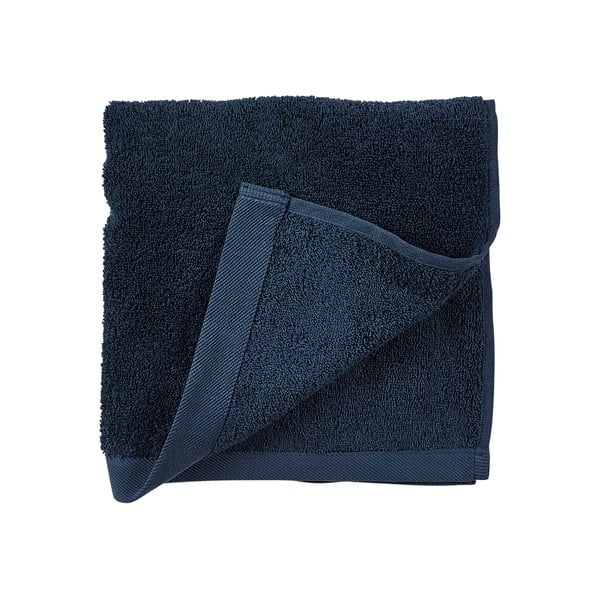 Niebieski ręcznik z bawełny frotte Södahl Indigo, 100x50 cm