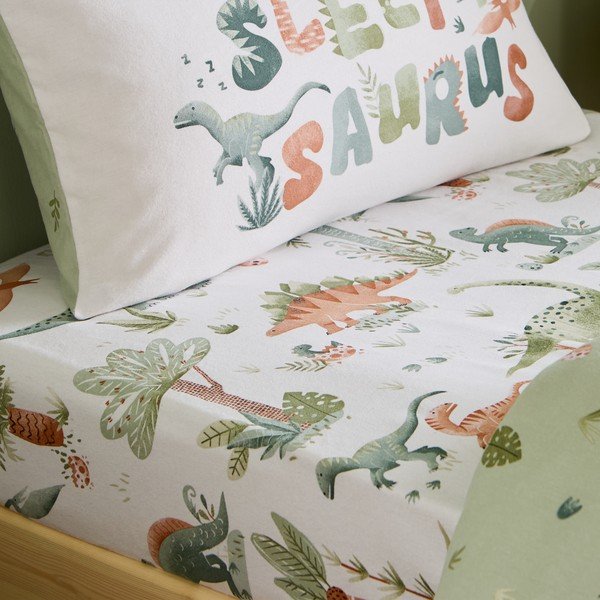 Kremowe flanelowe prześcieradło dziecięce jednoosobowe z gumką 90x190 cm Brushed Sleepy Saurus Dino – Catherine Lansfield