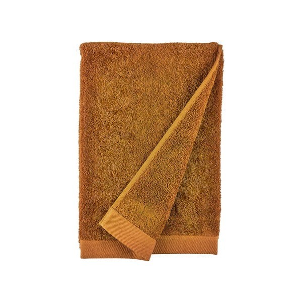 Pomarańczowy ręcznik kąpielowy z bawełny frotte Södahl Clay, 140x70 cm